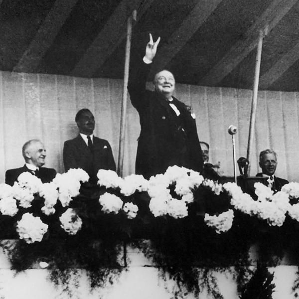 Winston Churchill showing the V for victory sign with his hand