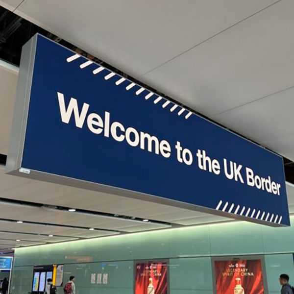 Blue sign that reads Welcome to the UK Border