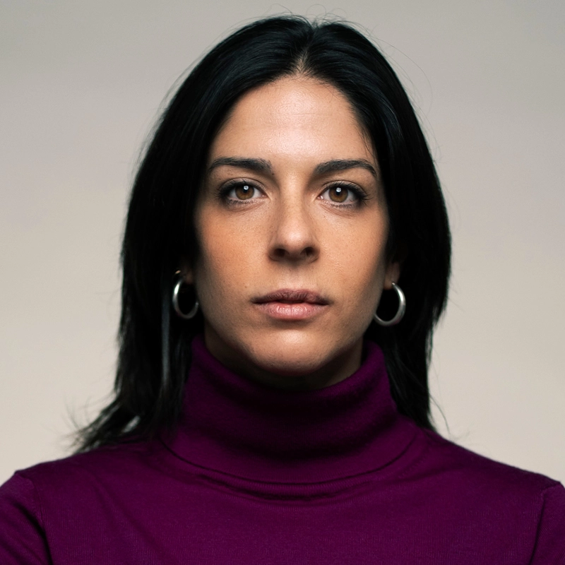Close up of Francessca Feo wearing a burgundy high neck jumper