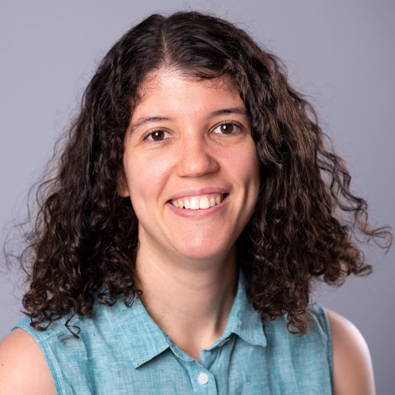 Close up of Paloma Caravantes Gonzalez wearing a blue sleeveless shirt, smiling
