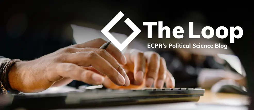 Close-up of hands typing on a keyboard with a pen in one hand. The Loop's logo with text 'ECPR's political science blog' appears top right.